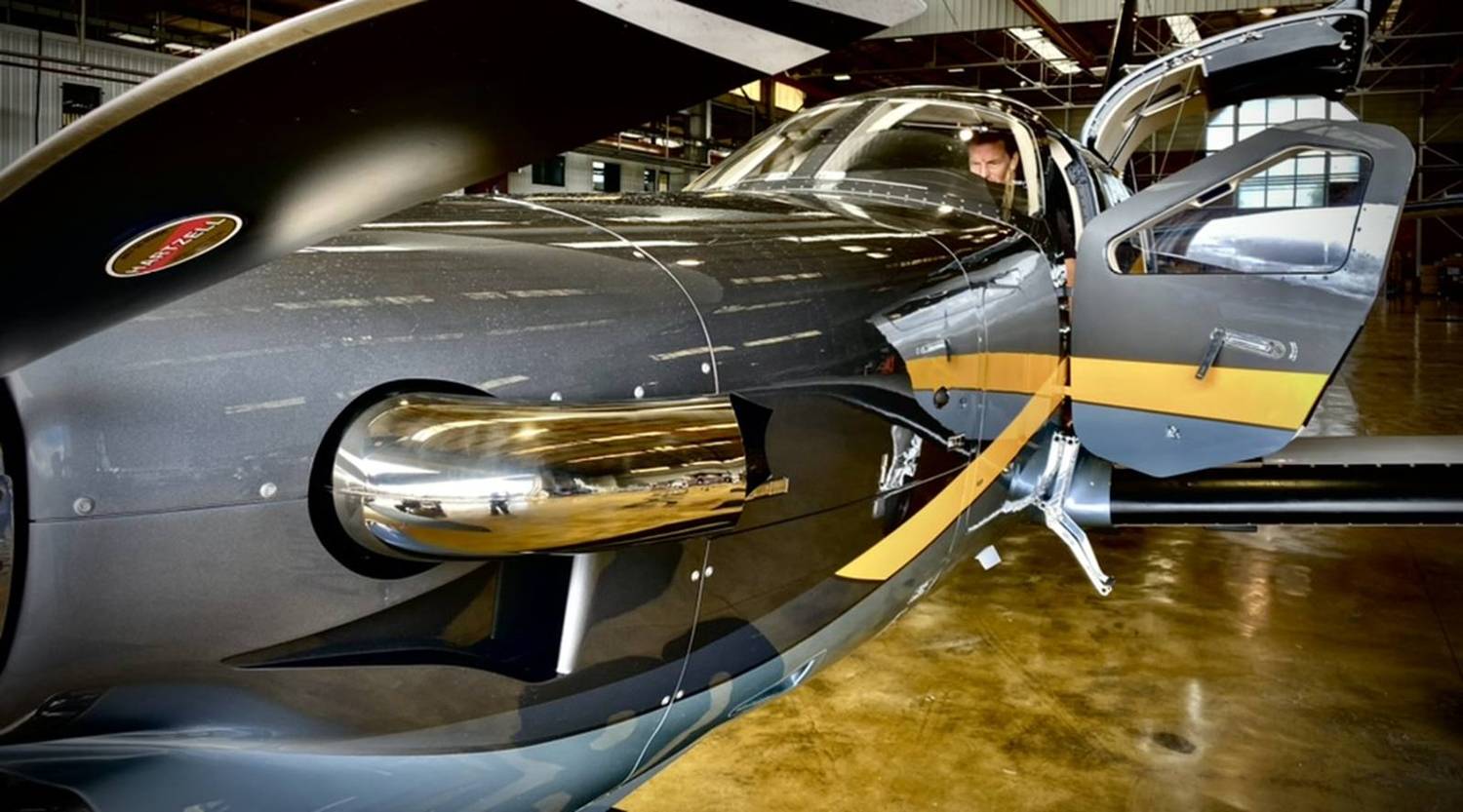 Monty in the cockpit of his TBM in the hangar